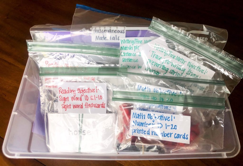 The photo above is a filled IEP Goal Bin. You can see here how to make separate bags in the bin for each objective on an IEP. Fill the bags with whatever materials are needed for that objective, then put a label on it for simple organization.