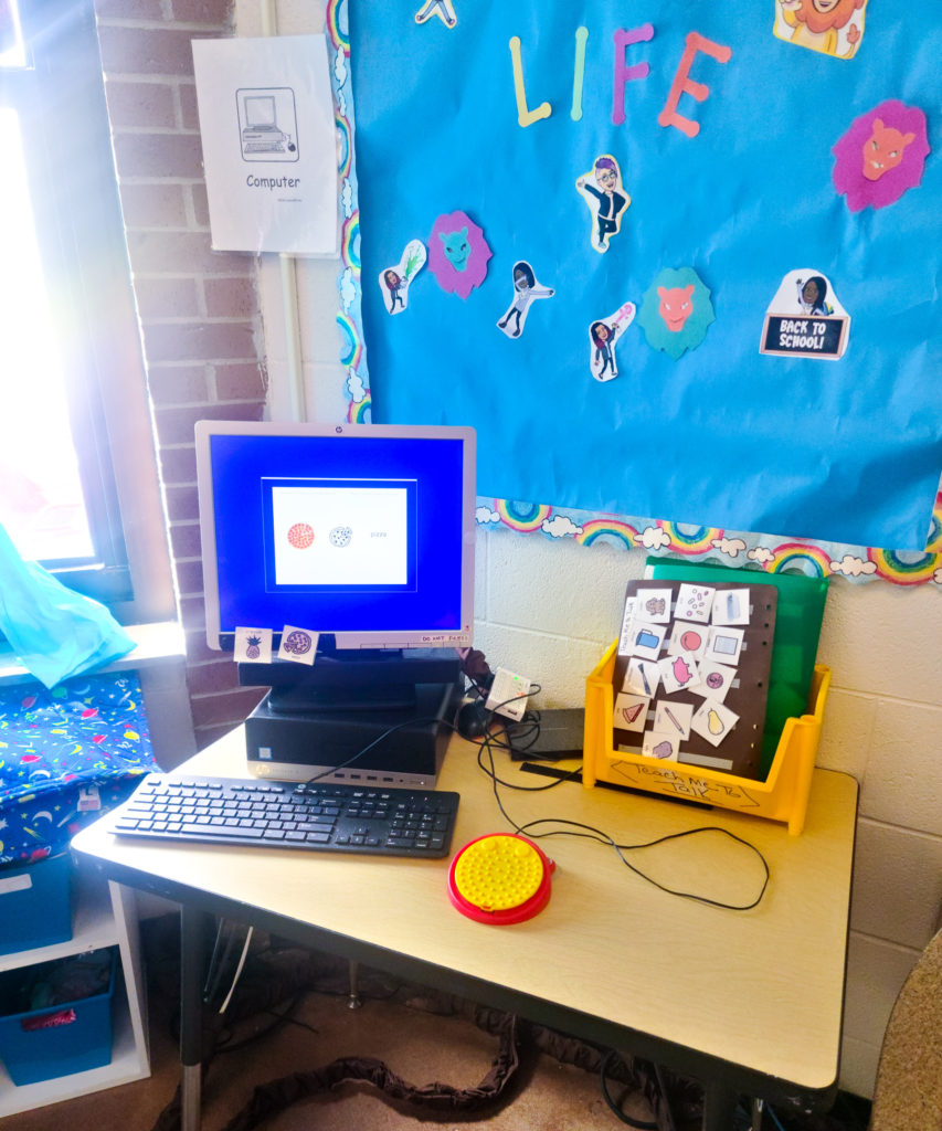 A computer with a switch connected to it.