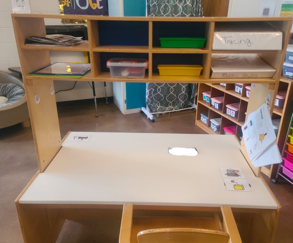 Desk with overhead storage.