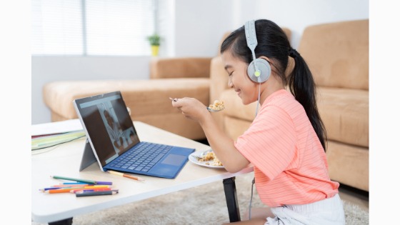 Picture showing student having a lunchtime hangout with teacher. 