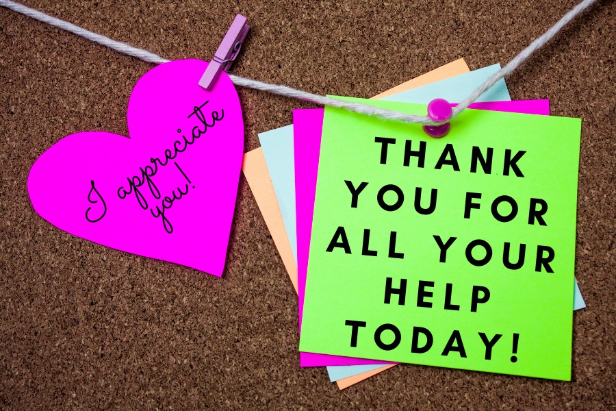 two sticky notes with thank you messages to give to your school based team members 