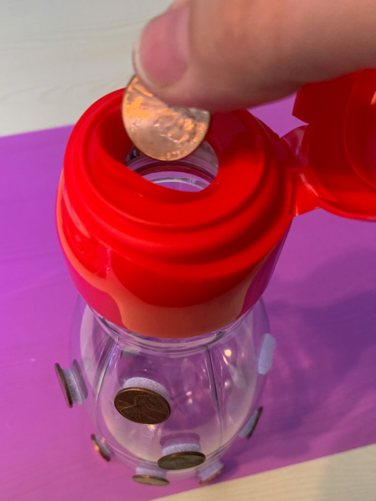 Putting pennies into a container