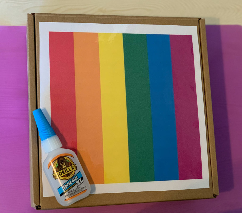 Start by printing an image, laminating it, and super gluing it to your box.