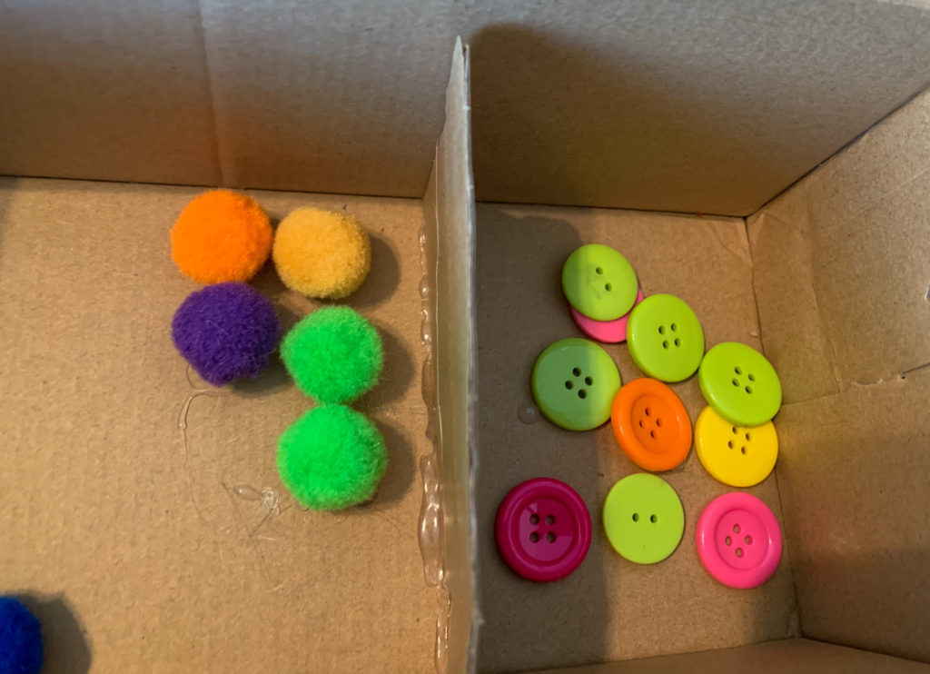 This piece of cardboard separates the inside of the box to check to see if students are correctly sorting.