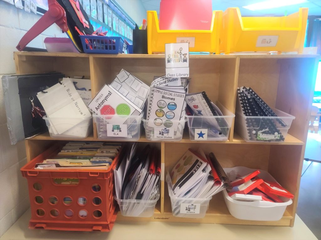 a shelf filled with education materials.