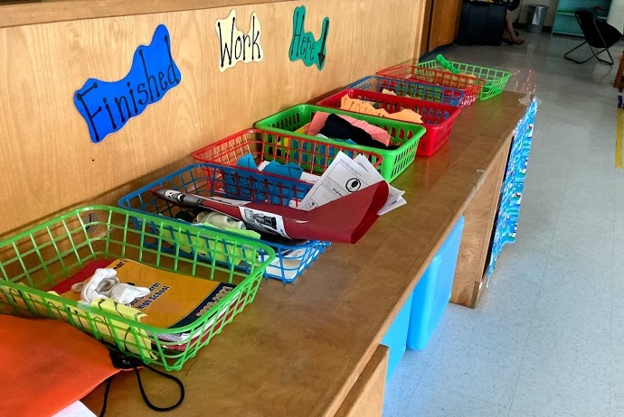 Students return their completed work to the baskets in this area. 