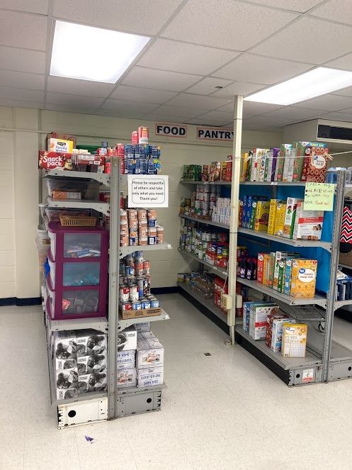 Our students work hard keeping up the school food pantry.