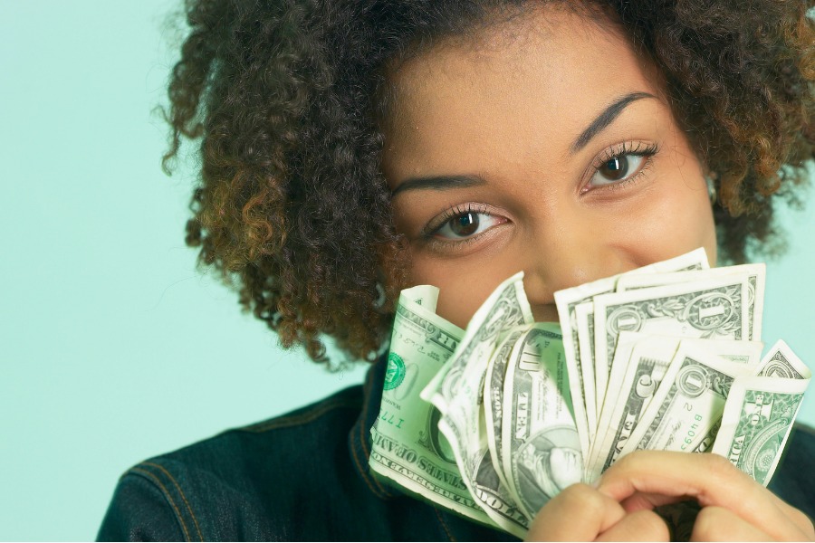 This is a photo of a woman holding money.