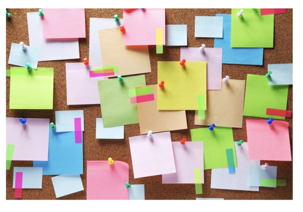cork board with sticky notes 