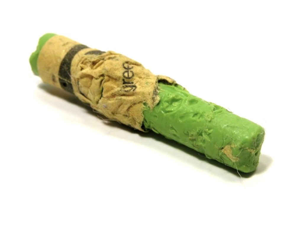 chewed green crayon