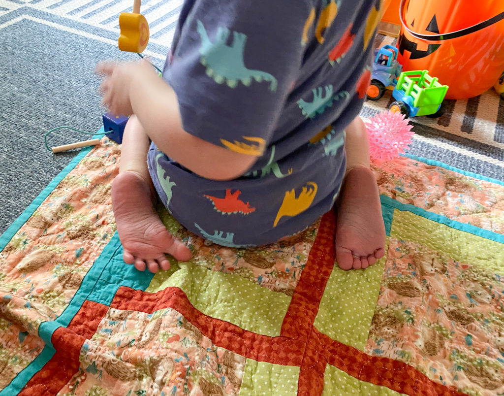 Child w-sitting showing back of feet 