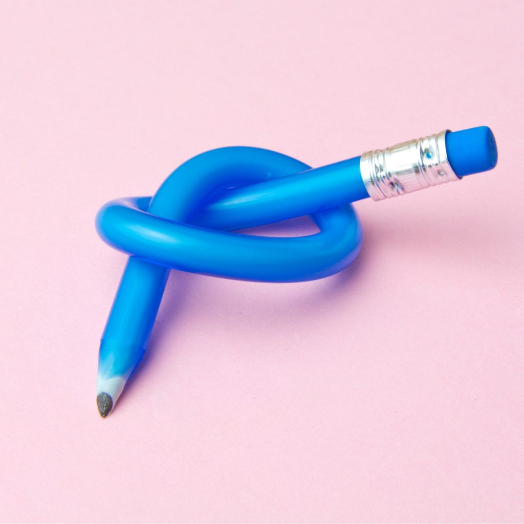 This is a photo of a blue pencil tied in a knot