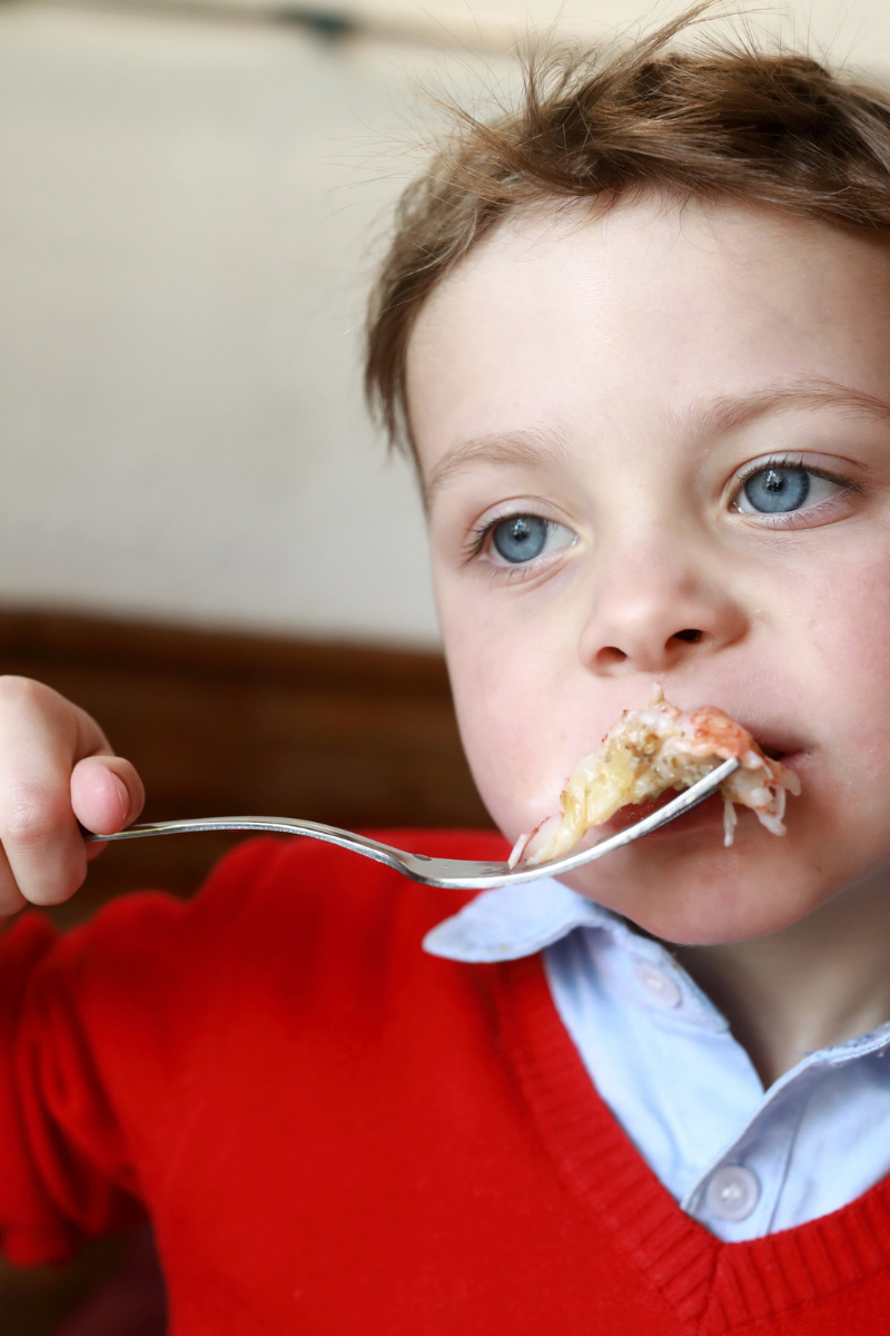 young boy eating