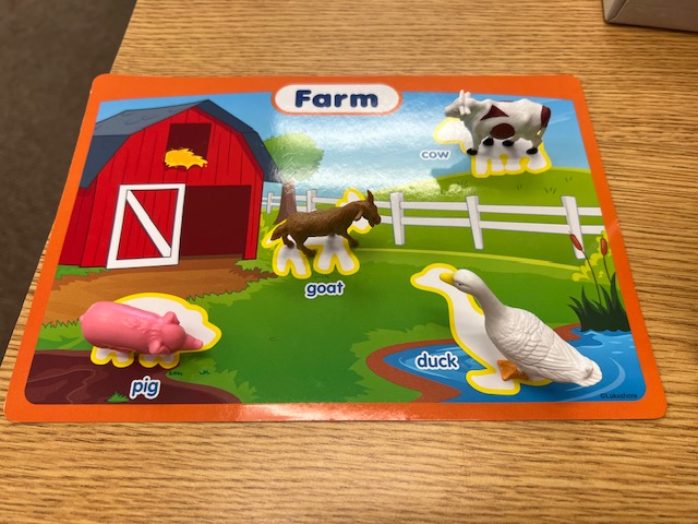This is a picture of a farm scene with animal objects.
