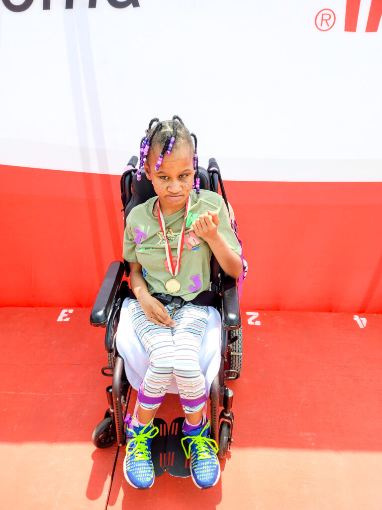 student with gold medal