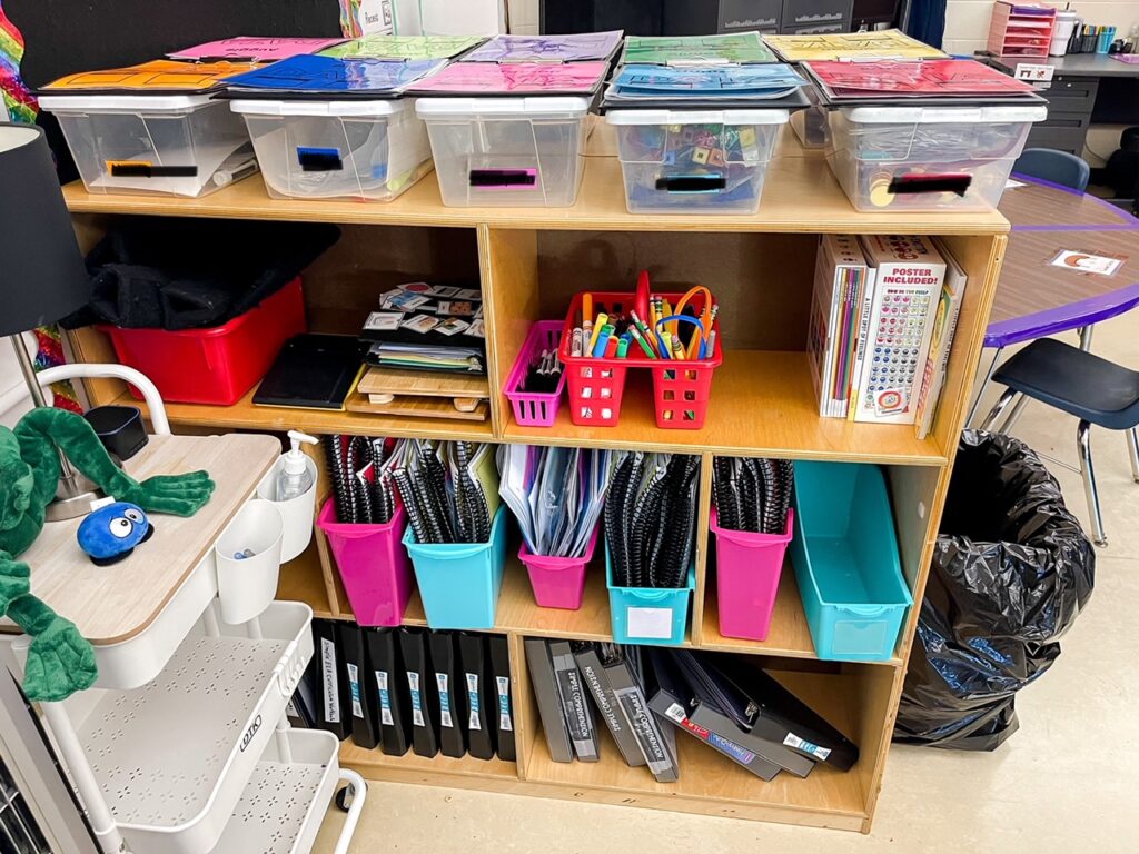 book bins and clipboards on a functional work shelf