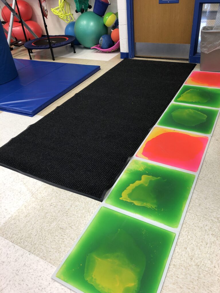 a picture of the author's sensory room entrance with sensory tiles to the right