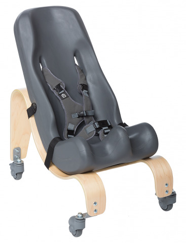 a grey special tomato chair used as equipment in a multiple disabilities classroom