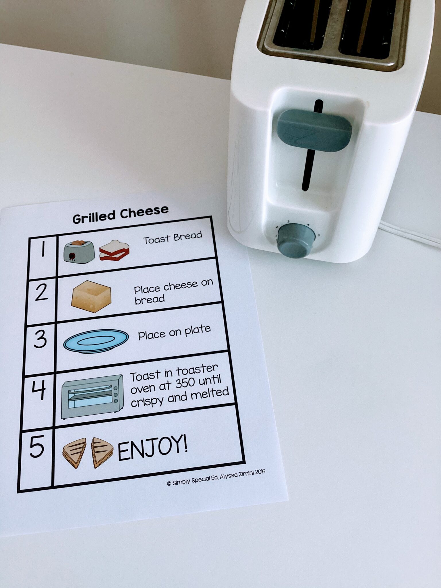 the grilled cheese recipe next to a toaster