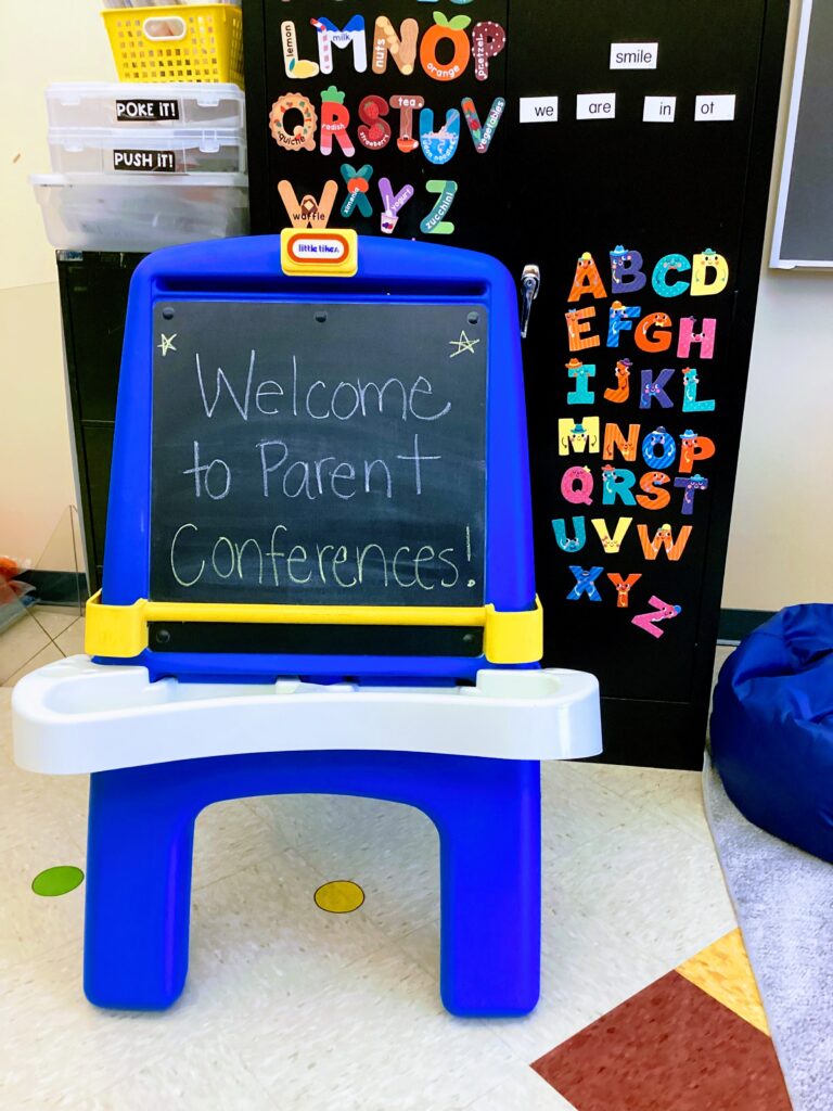 Little Tikes chalkboard with "Welcome to Parent Conferences" in the OT classroom