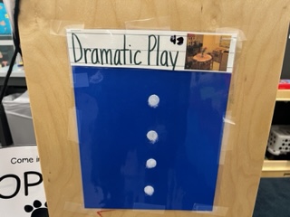 Dramatic play sign in sheet with velcro for centers.