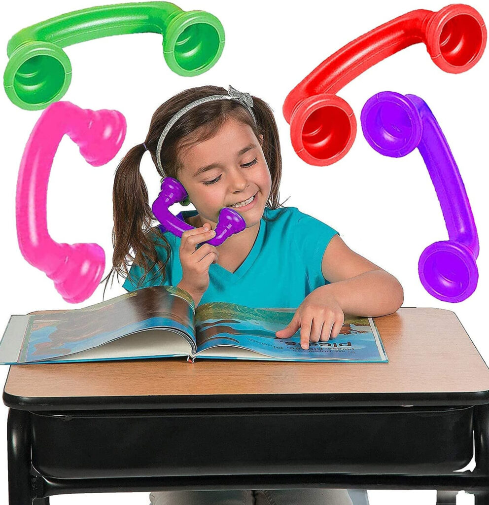 This is a picture of a student using a whisper phone. 