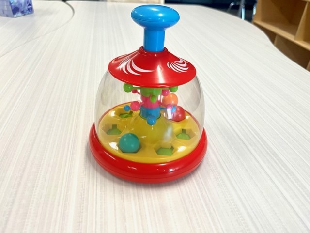 The balls move, it lights up and music plays when you push. Students love it!