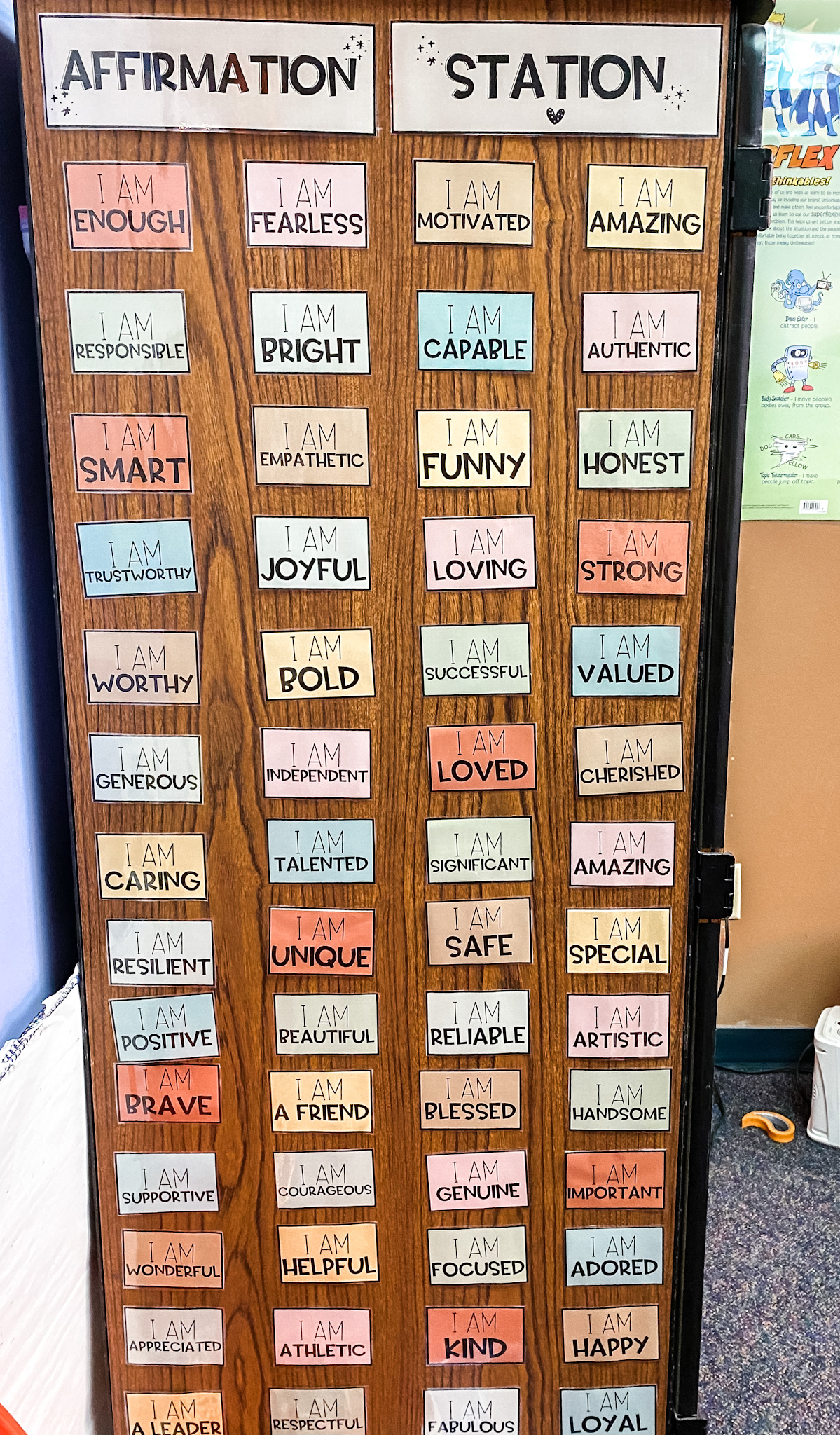 affirmations lined up on the side of the cabinet
