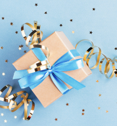 A wrapped present is shown on a blue background.