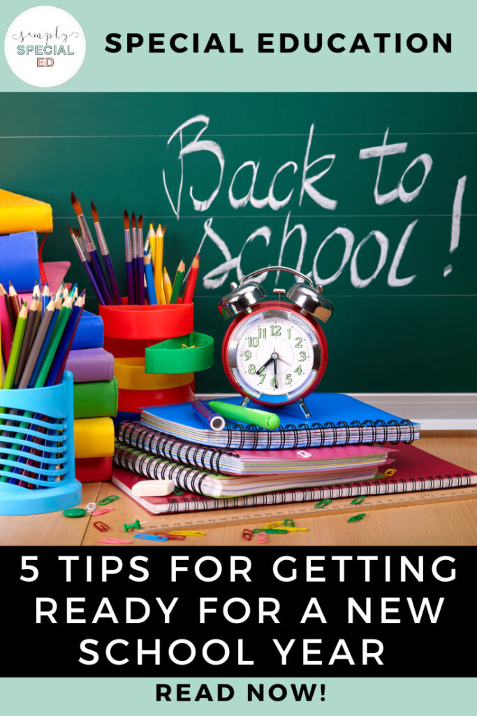 Back to school picture with notebooks, colored pencils and an alarm clock. 