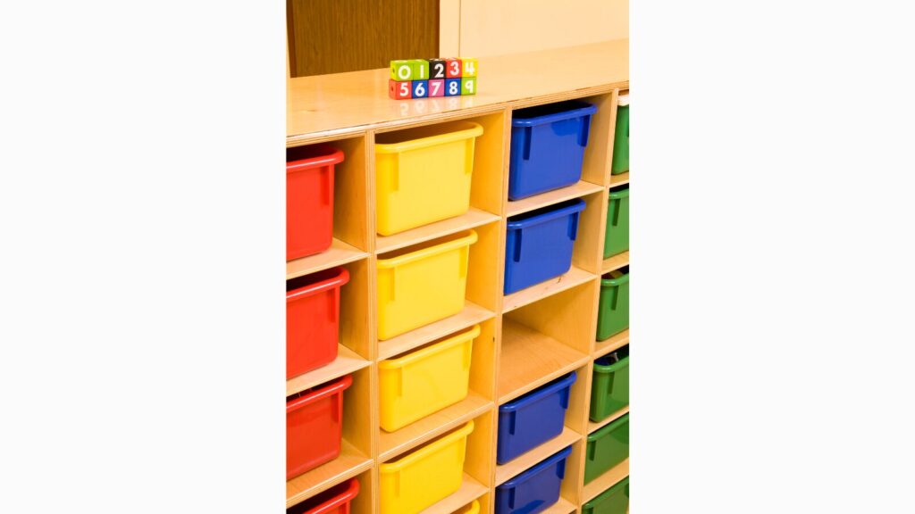 Image of colored plastic containers stored in a shelf