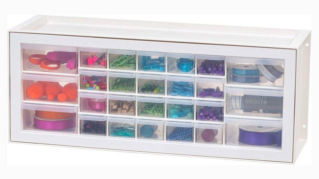 Image of a craft cabinet filled with teacher supplies such as pens, scissors, paper clips, and tape