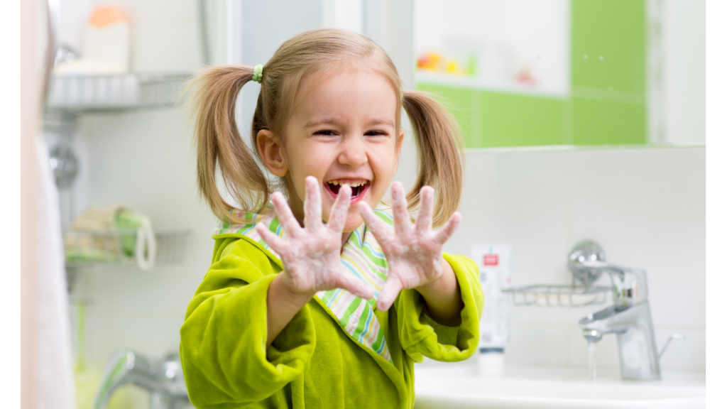 child washing her hands