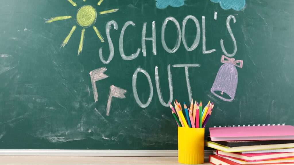 Picture of chalkboard with the words School’s out written. 