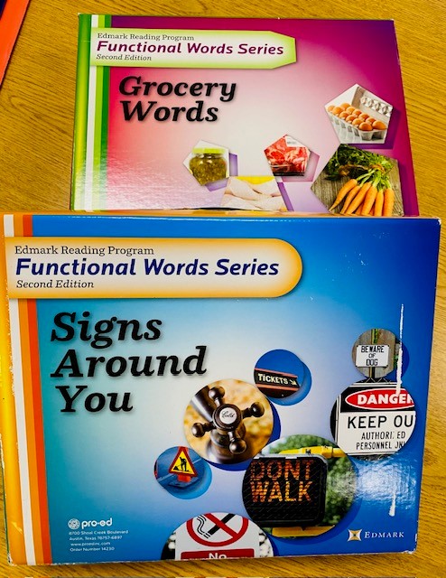 Two Edmark reading program boxes are shown: Signs Around You and Grocery Words.