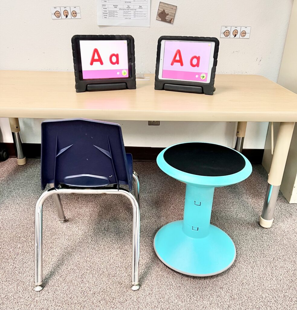 Picture of a center table with 2 iPads for computer based learning. 