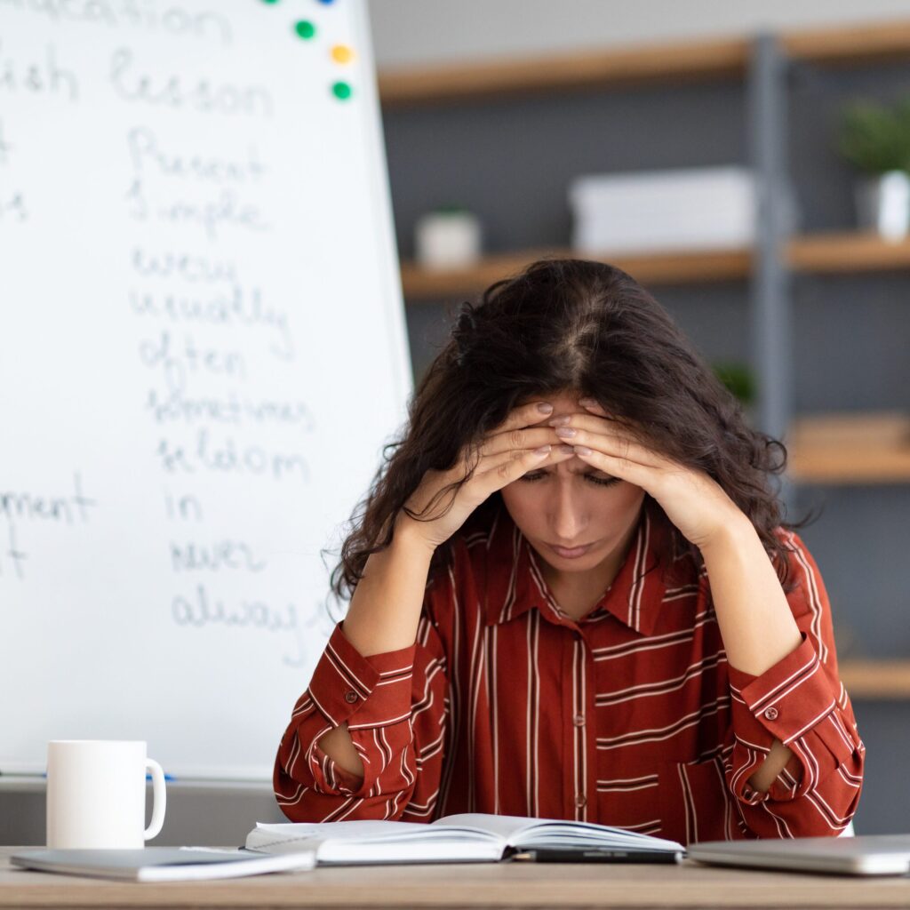 Special education teacher conversing with a parent, emphasizing effective communication and support strategies for challenging family dynamics.