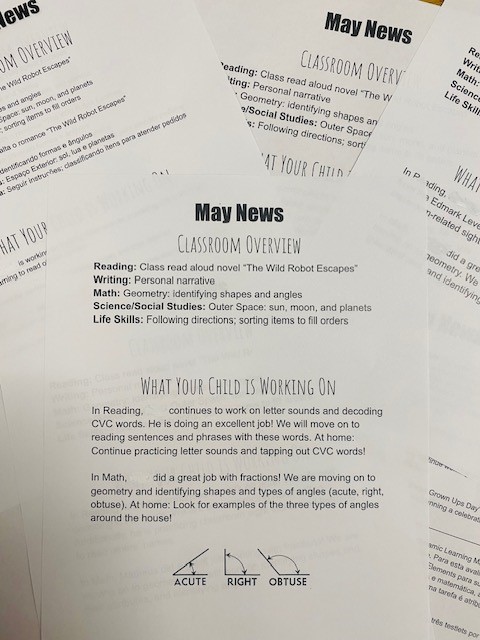 Classroom newsletters printed on white paper are labeled "May News"