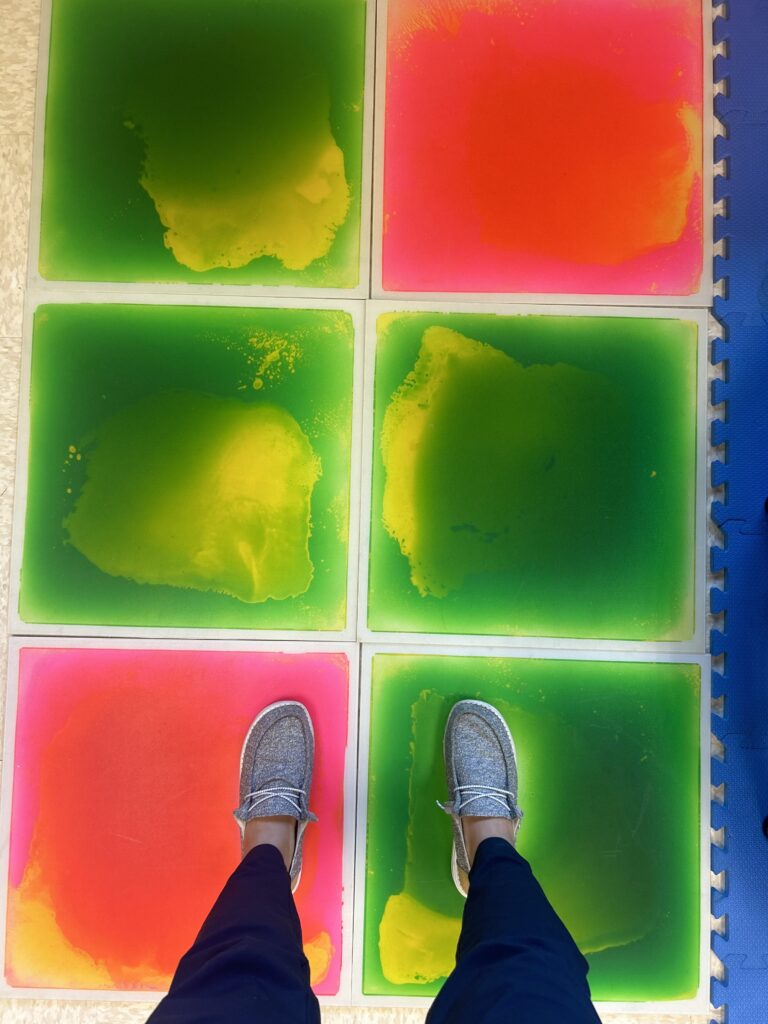 pink and green gel tiles with OT's feet standing on them