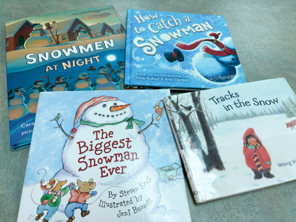 winter book companion books sit on a table with titles shown