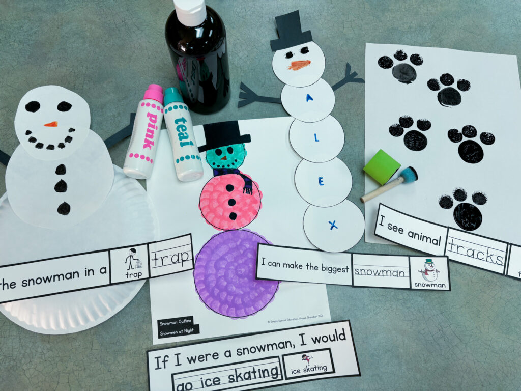 snowman winter book companion crafts on a table with art supplies