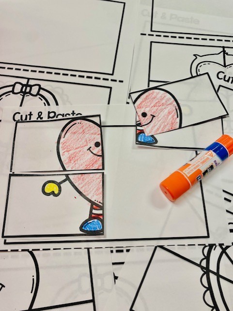 Valentine-themed fine motor cut and paste puzzles