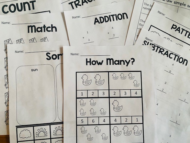 A group of worksheets with a variety of titles including "match," "how many?," "sort," "addition," and "subtraction" are shown.