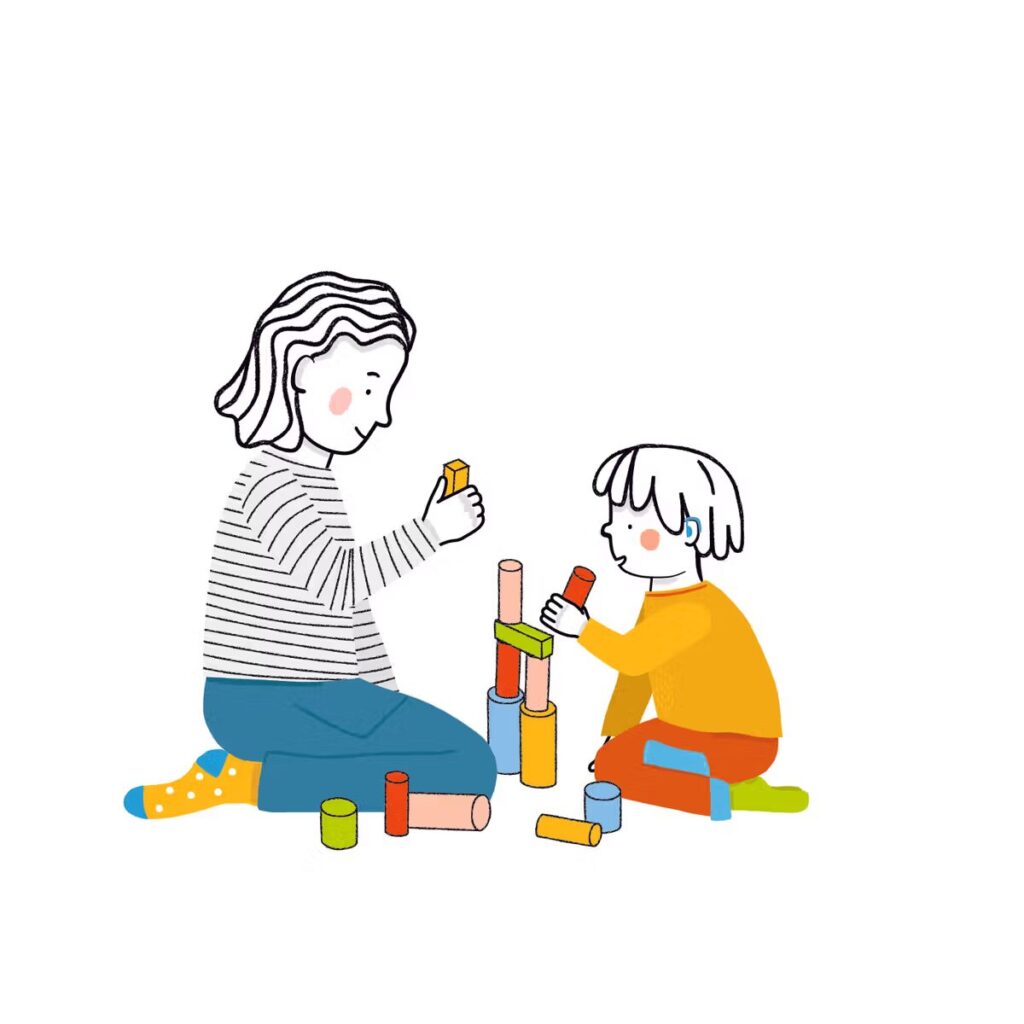 A child and an adult playing with blocks