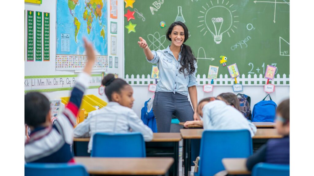 Image showing an adult standing in front of a class of student.
