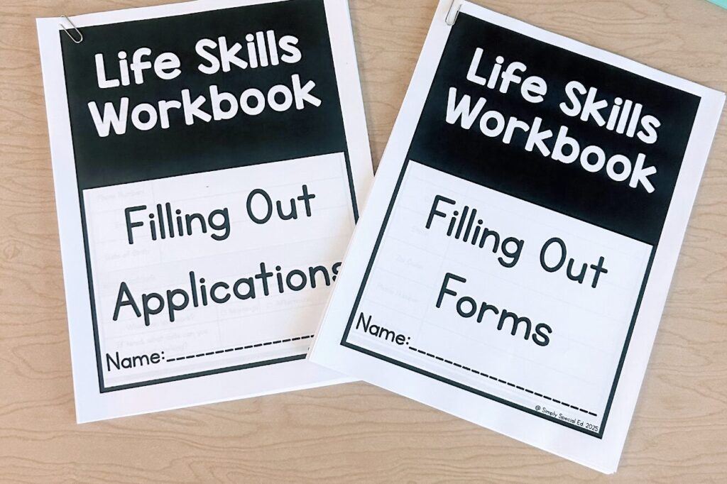 life skills workbooks, including filling out forms and filling out applications, sit on a desktop