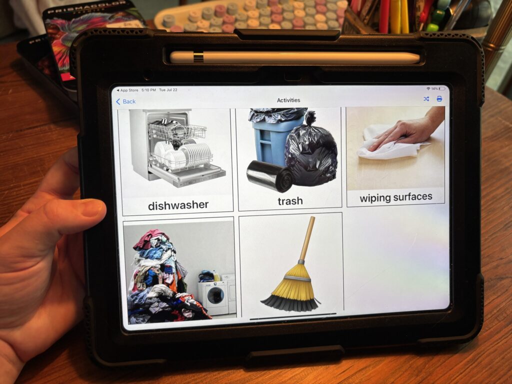 a functional communication app is shown on an iPad with a variety of cleaning tasks displayed