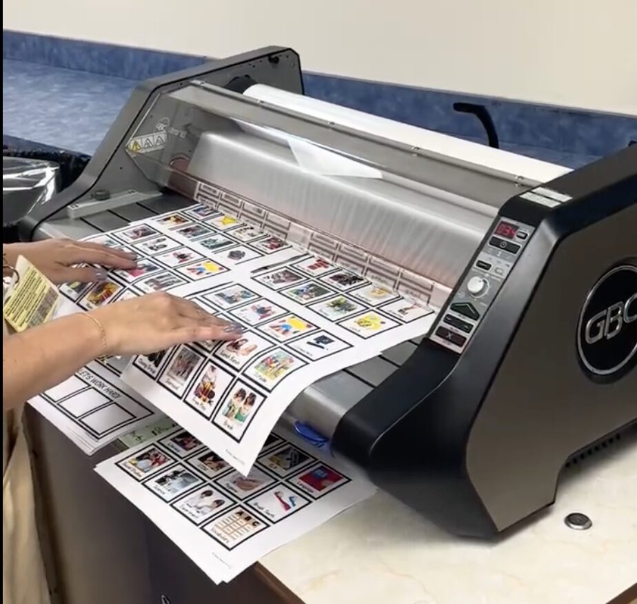 Laminating the picture icons for the sensory menu