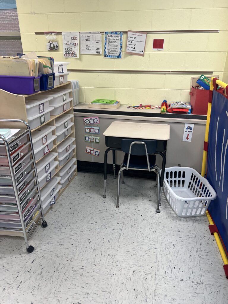 Independent work station with task bins and laundry basket
