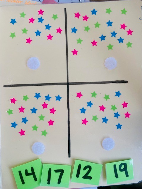 A file folder activity with colorful star stickers for studnets to count, and numbers for matching.